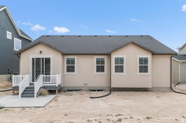 1881 E Moho Mtn, Eagle Mountain, UT 84005 - back of property featuring a shingled roof, a wooden deck, and stucco siding