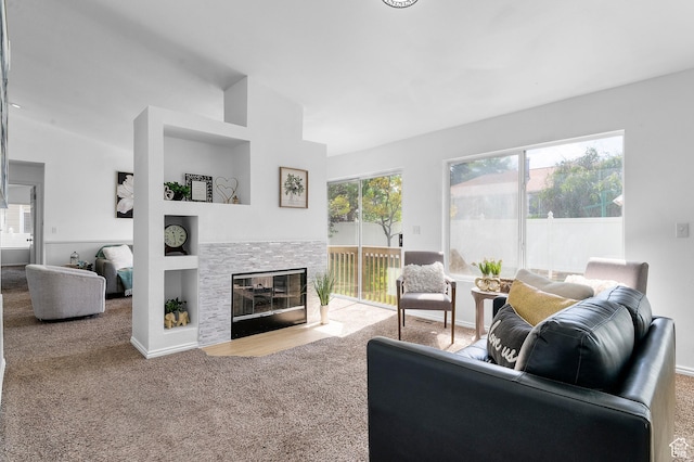 9152 S Crystal Vista Ln, West Jordan, UT 84088 - living area featuring carpet, a stone fireplace, and vaulted ceiling