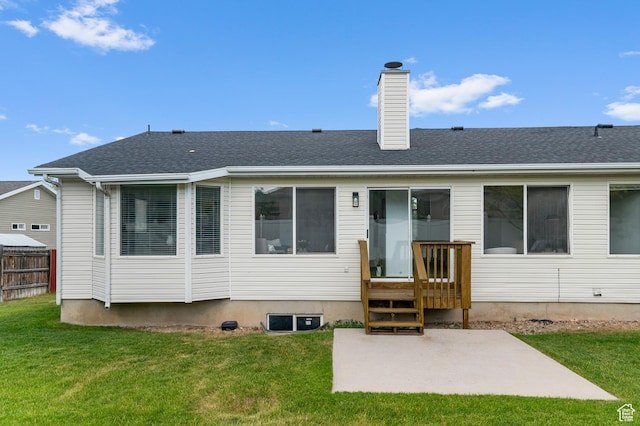 9152 S Crystal Vista Ln, West Jordan, UT 84088 - back of property featuring a patio, a chimney, and a shingled roof