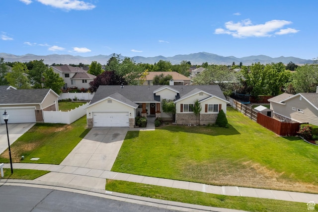 9152 S Crystal Vista Ln, West Jordan, UT 84088 - view of front of home with a residential view, concrete driveway, a mountain view, and a garage