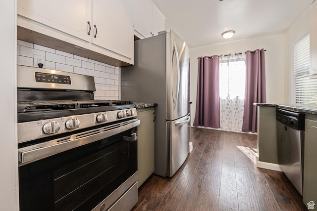 1344 E 23rd St N, Ogden, UT 84401 - kitchen with appliances with stainless steel finishes, dark wood-style flooring, backsplash, and white cabinetry