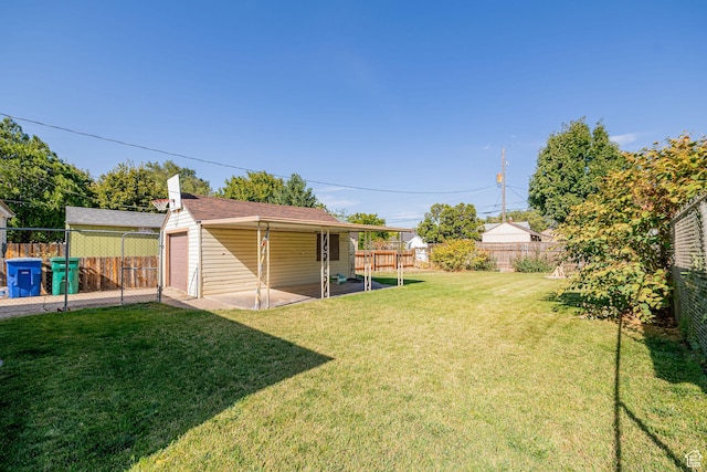 1344 E 23rd St N, Ogden, UT 84401 - fenced backyard featuring an outbuilding, a patio, and a detached garage