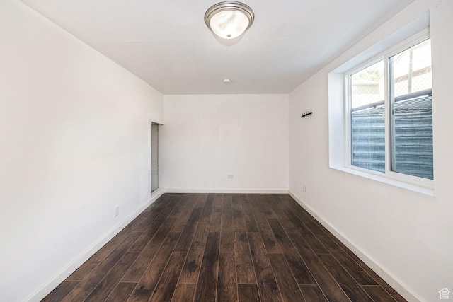 1344 E 23rd St N, Ogden, UT 84401 - spare room featuring dark wood-type flooring and baseboards