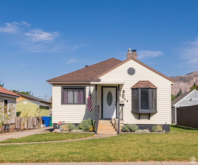 1344 E 23rd St N, Ogden, UT 84401 - bungalow-style house with a shingled roof, a chimney, and a mountain view