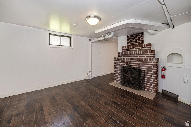 1344 E 23rd St N, Ogden, UT 84401 - unfurnished living room with a fireplace and wood finished floors