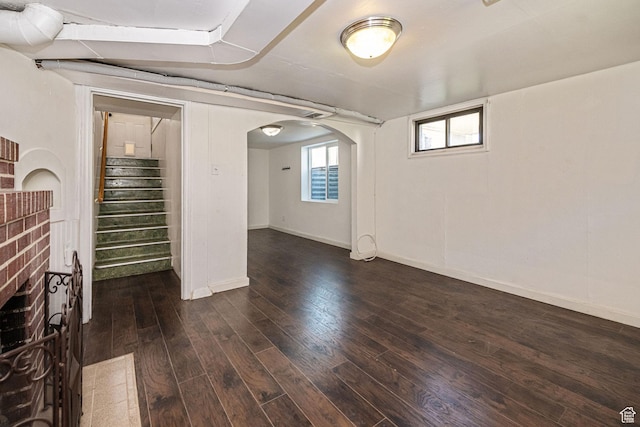 1344 E 23rd St N, Ogden, UT 84401 - basement with dark wood-style flooring, arched walkways, and stairs