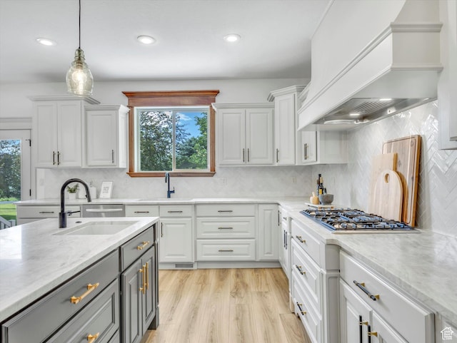 6037 Chamberry Way N, Highland, UT 84003 - kitchen with custom exhaust hood, gray cabinetry, white cabinetry, pendant lighting, and recessed lighting