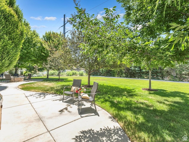 6037 Chamberry Way N, Highland, UT 84003 - view of property's community featuring a patio and a lawn
