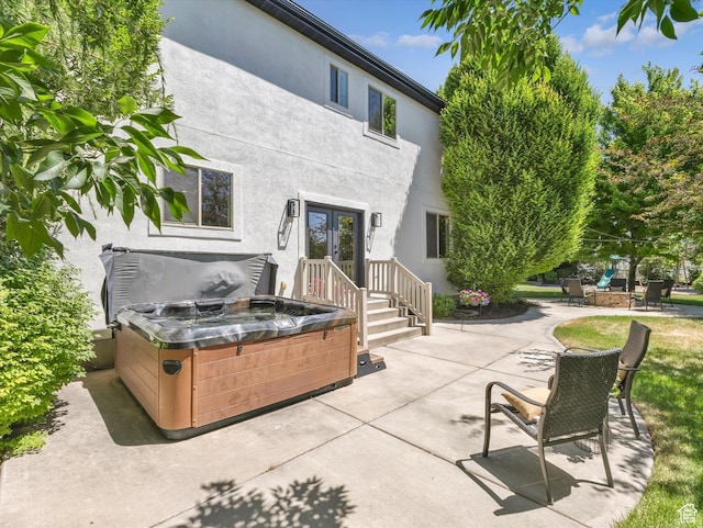 6037 Chamberry Way N, Highland, UT 84003 - view of patio / terrace with french doors and a hot tub