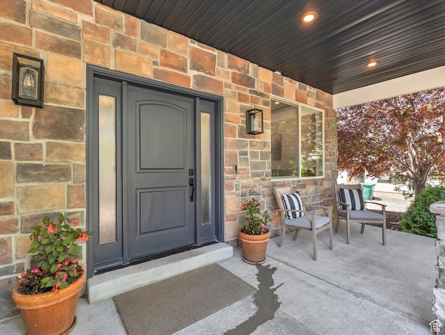 6037 Chamberry Way N, Highland, UT 84003 - doorway to property featuring a porch and stone siding