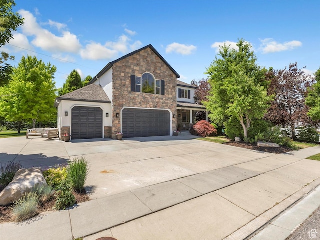 6037 Chamberry Way N, Highland, UT 84003 - traditional-style house featuring stone siding, concrete driveway, stucco siding, and a garage
