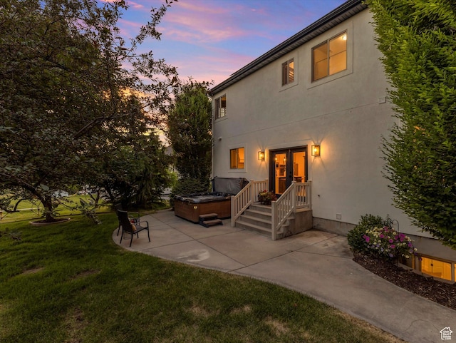 6037 Chamberry Way N, Highland, UT 84003 - back of house featuring a patio, a hot tub, a lawn, french doors, and stucco siding