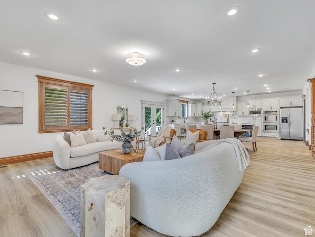 6037 Chamberry Way N, Highland, UT 84003 - living area featuring recessed lighting, light wood finished floors, a chandelier, and french doors