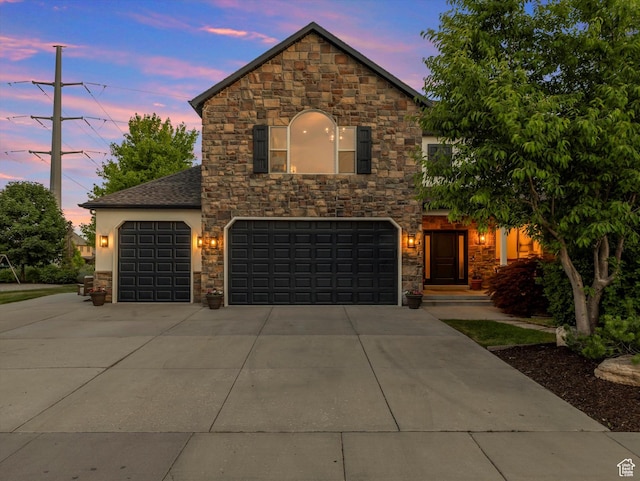 6037 Chamberry Way N, Highland, UT 84003 - view of front of home with stone siding, concrete driveway, and stucco siding