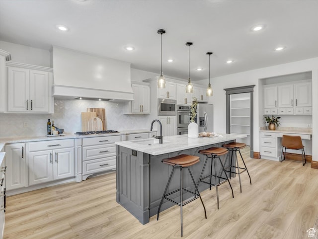 6037 Chamberry Way N, Highland, UT 84003 - kitchen featuring appliances with stainless steel finishes, white cabinetry, light wood-style floors, and recessed lighting
