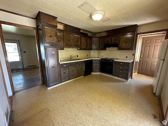 250 E Beryl, South Salt Lake, UT 84115 - kitchen featuring black appliances, under cabinet range hood, dark brown cabinets, and light countertops
