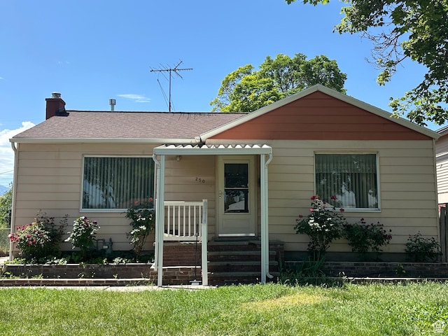250 E Beryl, South Salt Lake, UT 84115 - bungalow-style house with a front yard, a chimney, and a shingled roof