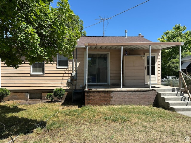 250 E Beryl, South Salt Lake, UT 84115 - back of property featuring roof with shingles and a yard
