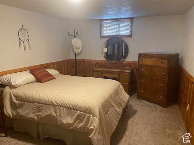 535 W 500 N, Malad City, ID 83252 - bedroom featuring light carpet, wood walls, and wainscoting