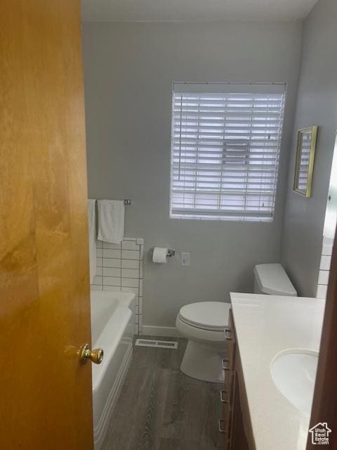 535 W 500 N, Malad City, ID 83252 - full bathroom featuring vanity, a bath, and wood finished floors
