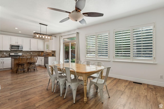 15106 S Heather Stone Cir, Draper, UT 84020 - dining area with ceiling fan, wood finished floors, and recessed lighting