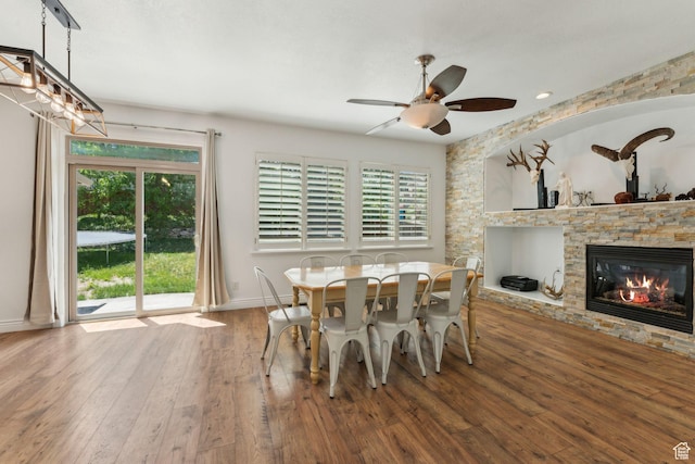 15106 S Heather Stone Cir, Draper, UT 84020 - dining space with hardwood / wood-style flooring, healthy amount of natural light, a fireplace, and ceiling fan
