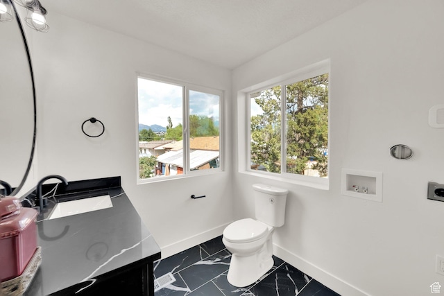 1003 E Platinum Way, Sandy, UT 84094 - half bath with marble look tile flooring, vanity, and a mountain view