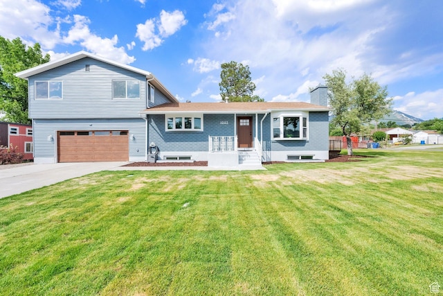 1003 E Platinum Way, Sandy, UT 84094 - split level home with driveway, a front yard, a garage, and a chimney
