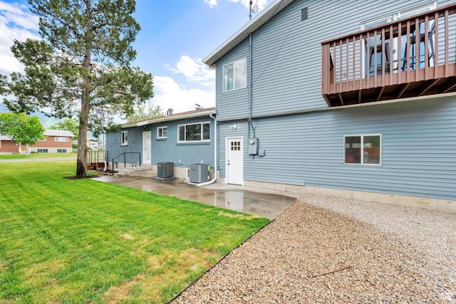 1003 E Platinum Way, Sandy, UT 84094 - rear view of house with a yard and a patio area