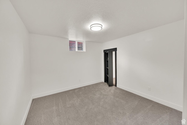 1003 E Platinum Way, Sandy, UT 84094 - carpeted empty room with a textured ceiling and baseboards