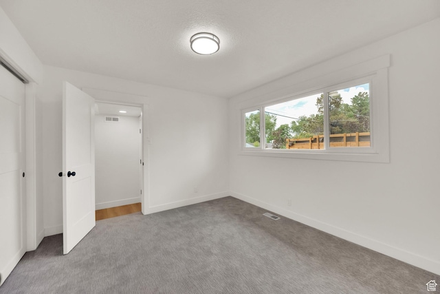 1003 E Platinum Way, Sandy, UT 84094 - unfurnished bedroom featuring carpet flooring and a closet