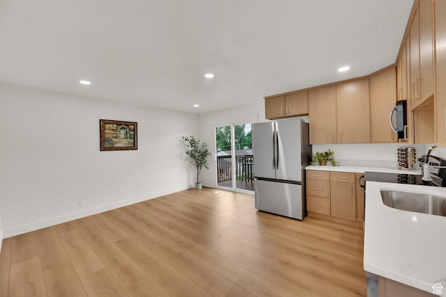 1003 E Platinum Way, Sandy, UT 84094 - kitchen with appliances with stainless steel finishes, light countertops, light wood-type flooring, recessed lighting, and light brown cabinets