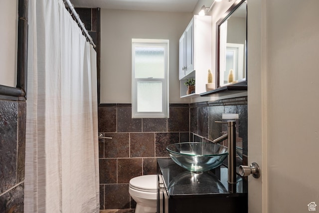 1523 E 3115 S, Millcreek, UT 84106 - bathroom featuring tile walls, vanity, a shower with shower curtain, and wainscoting