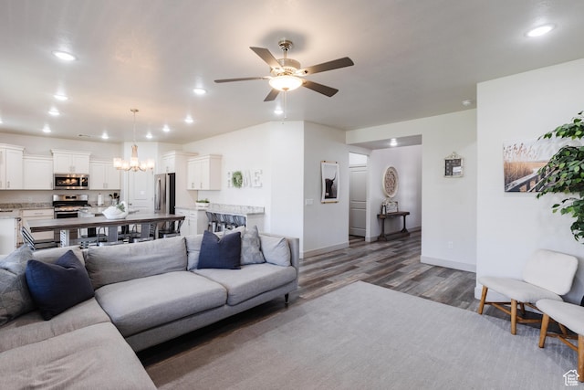 344 N Puerta Dr, Washington, UT 84780 - living area featuring wood finished floors, a ceiling fan, a chandelier, and recessed lighting