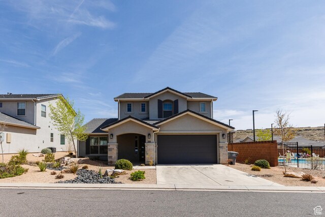 344 N Puerta Dr, Washington, UT 84780 - traditional home featuring concrete driveway, stucco siding, and stone siding