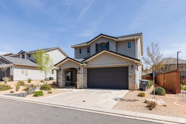 344 N Puerta Dr, Washington, UT 84780 - traditional-style house featuring stucco siding, driveway, stone siding, and a garage