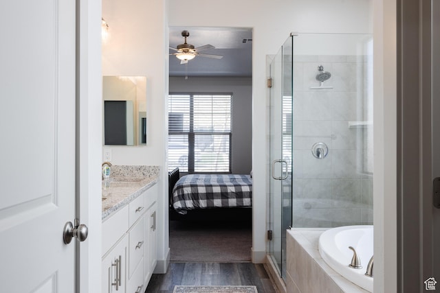 344 N Puerta Dr, Washington, UT 84780 - bathroom featuring a shower stall, ceiling fan, a garden tub, vanity, and wood finished floors