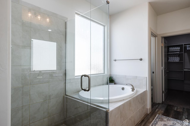 344 N Puerta Dr, Washington, UT 84780 - bathroom with wood finished floors, a bath, and a shower stall