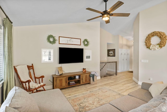 448 Lourdes Ln, Stansbury Park, UT 84074 - living room featuring vaulted ceiling, a ceiling fan, and light wood finished floors