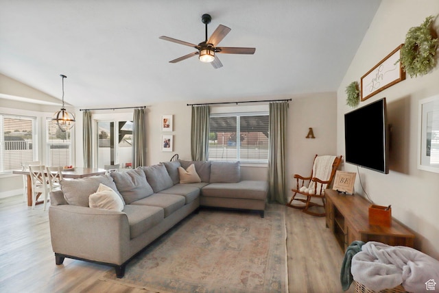 448 Lourdes Ln, Stansbury Park, UT 84074 - living area with vaulted ceiling, light wood-style floors, and a ceiling fan
