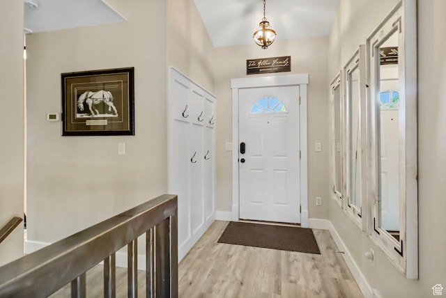 448 Lourdes Ln, Stansbury Park, UT 84074 - foyer entrance featuring healthy amount of natural light and light wood-style flooring