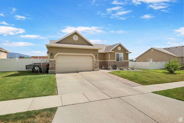 448 Lourdes Ln, Stansbury Park, UT 84074 - view of front of house featuring stucco siding, stone siding, driveway, and a garage