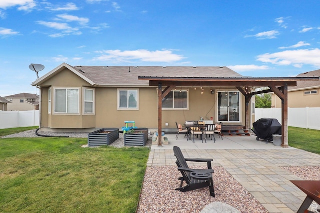 448 Lourdes Ln, Stansbury Park, UT 84074 - rear view of house with a fenced backyard, a patio area, stucco siding, and roof with shingles