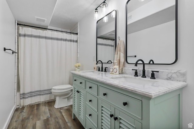 448 Lourdes Ln, Stansbury Park, UT 84074 - full bath featuring double vanity, wood finished floors, and shower / bath combo