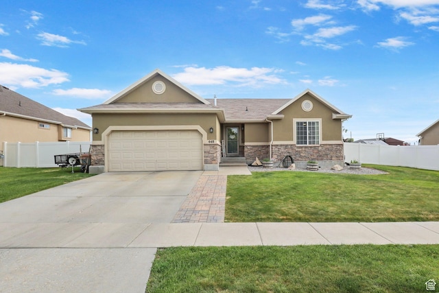 448 Lourdes Ln, Stansbury Park, UT 84074 - view of front of property featuring stucco siding, stone siding, an attached garage, and concrete driveway
