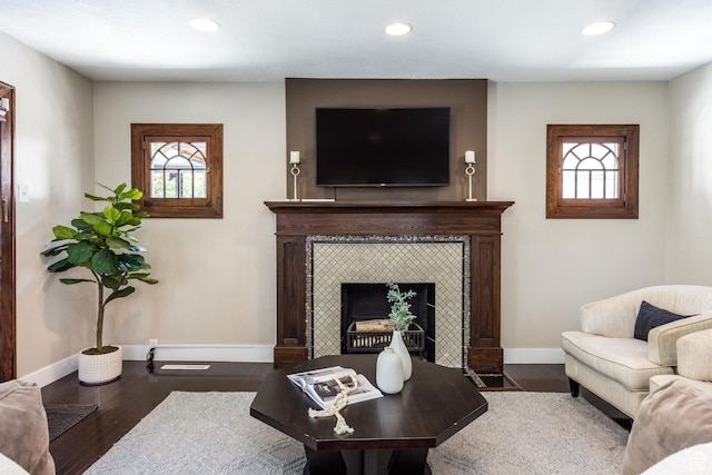 1603 S 1600 E, Salt Lake City, UT 84105 - living room featuring a tiled fireplace, recessed lighting, plenty of natural light, and wood finished floors