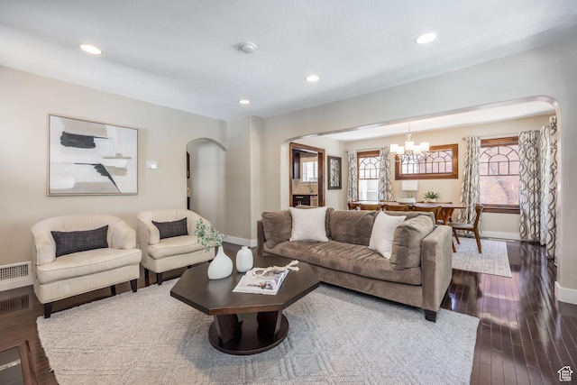 1603 S 1600 E, Salt Lake City, UT 84105 - living room with arched walkways, a chandelier, dark wood finished floors, and recessed lighting