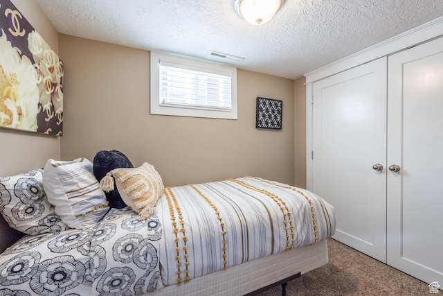 1603 S 1600 E, Salt Lake City, UT 84105 - bedroom with carpet flooring, a closet, and a textured ceiling