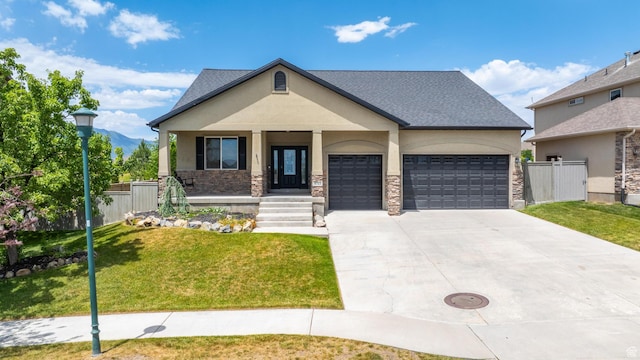 8743 N Franklin Dr E, Eagle Mountain, UT 84005 - view of front of home featuring an attached garage, concrete driveway, stucco siding, a porch, and stone siding