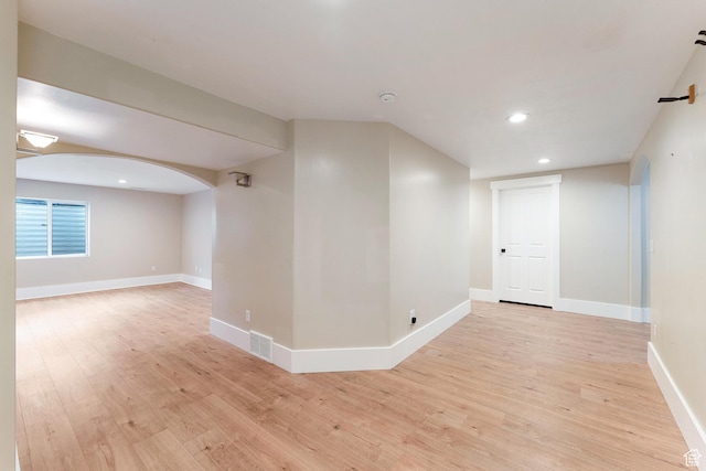 8743 N Franklin Dr E, Eagle Mountain, UT 84005 - unfurnished room featuring light wood-style floors, recessed lighting, and arched walkways